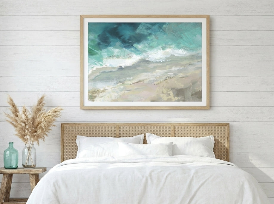 Modern wall art print styled on the wall in a coastal bedroom