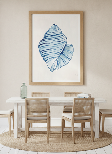 Modern wall art print styled on the wall in a coastal dining room