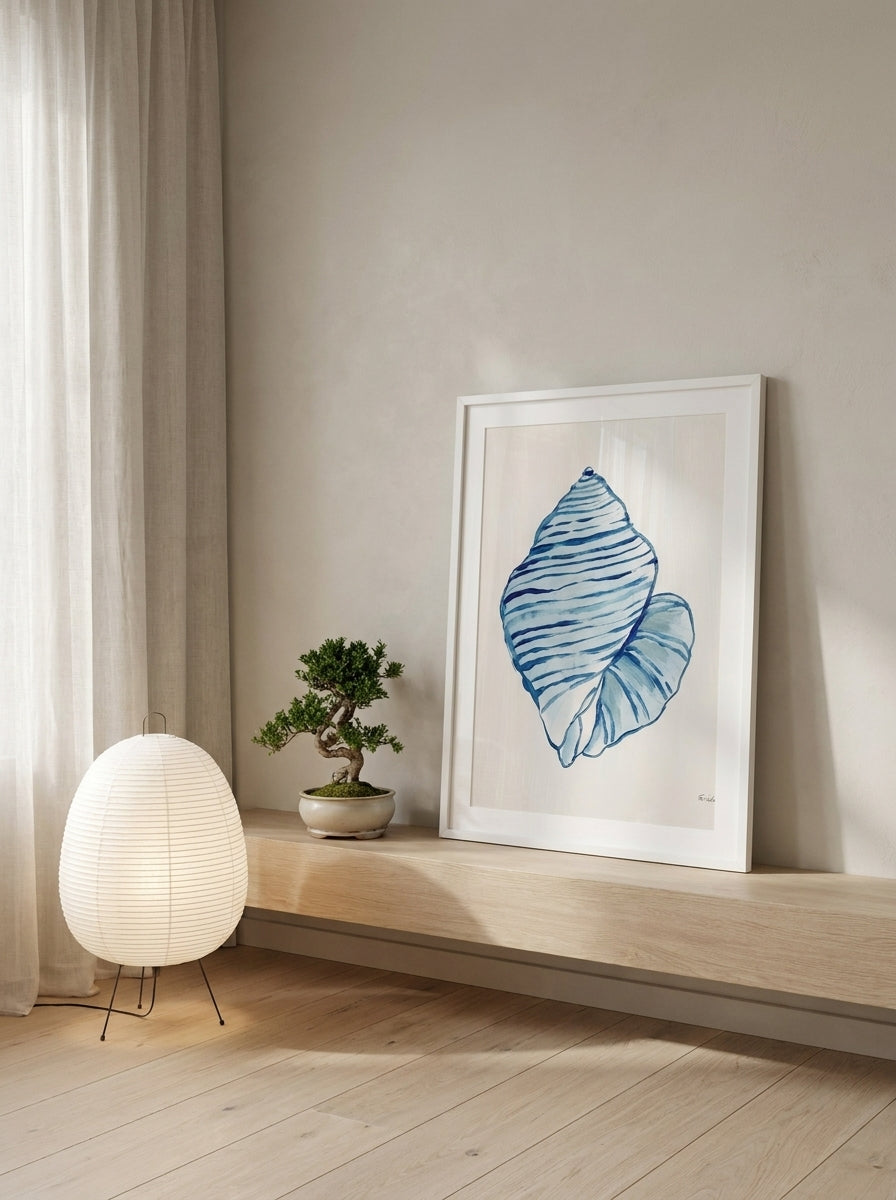 Modern wall art print standing on a shelf in a warm Japandi bedroom