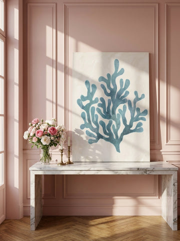 Stretched canvas wall art standing on a console in a Parisian bathroom
