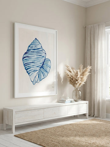 Oversized statement modern wall art print styled on the wall in a coastal living room