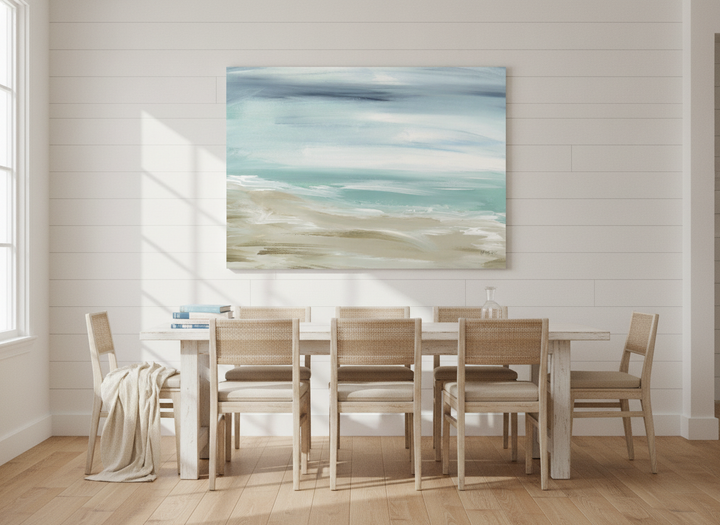 Stretched canvas wall art styled on the wall in a coastal dining room