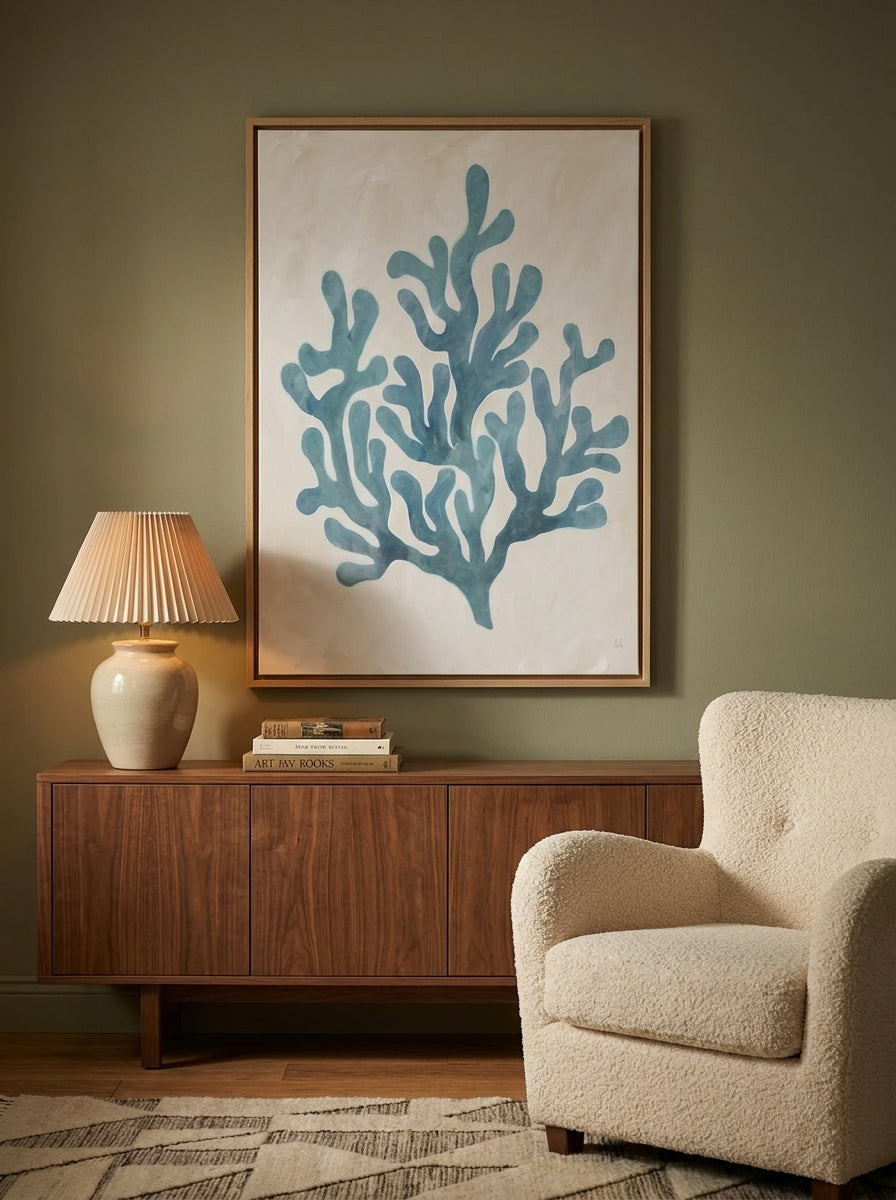 Oversized statement canvas wall art with a natural timber surround styled on the wall in a mid-century living room