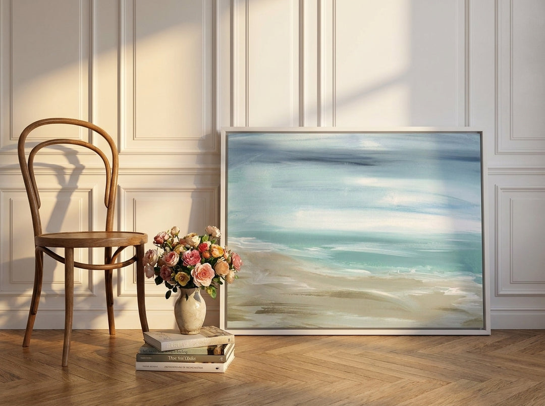 Canvas wall art with a white surround leaning against the wall in a Parisian bathroom