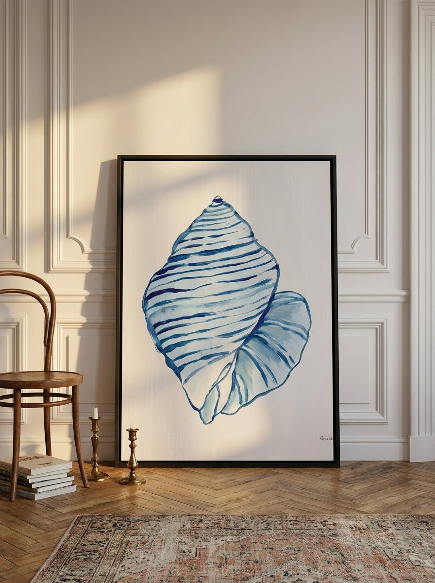 Oversized statement canvas wall art with a black surround leaning against the wall in a Parisian living room