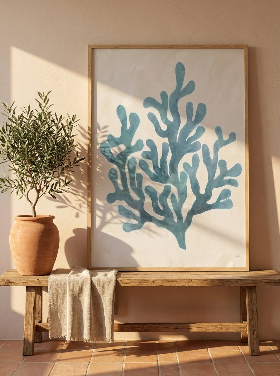 Modern wall art print standing on a bench in a Mediterranean bedroom