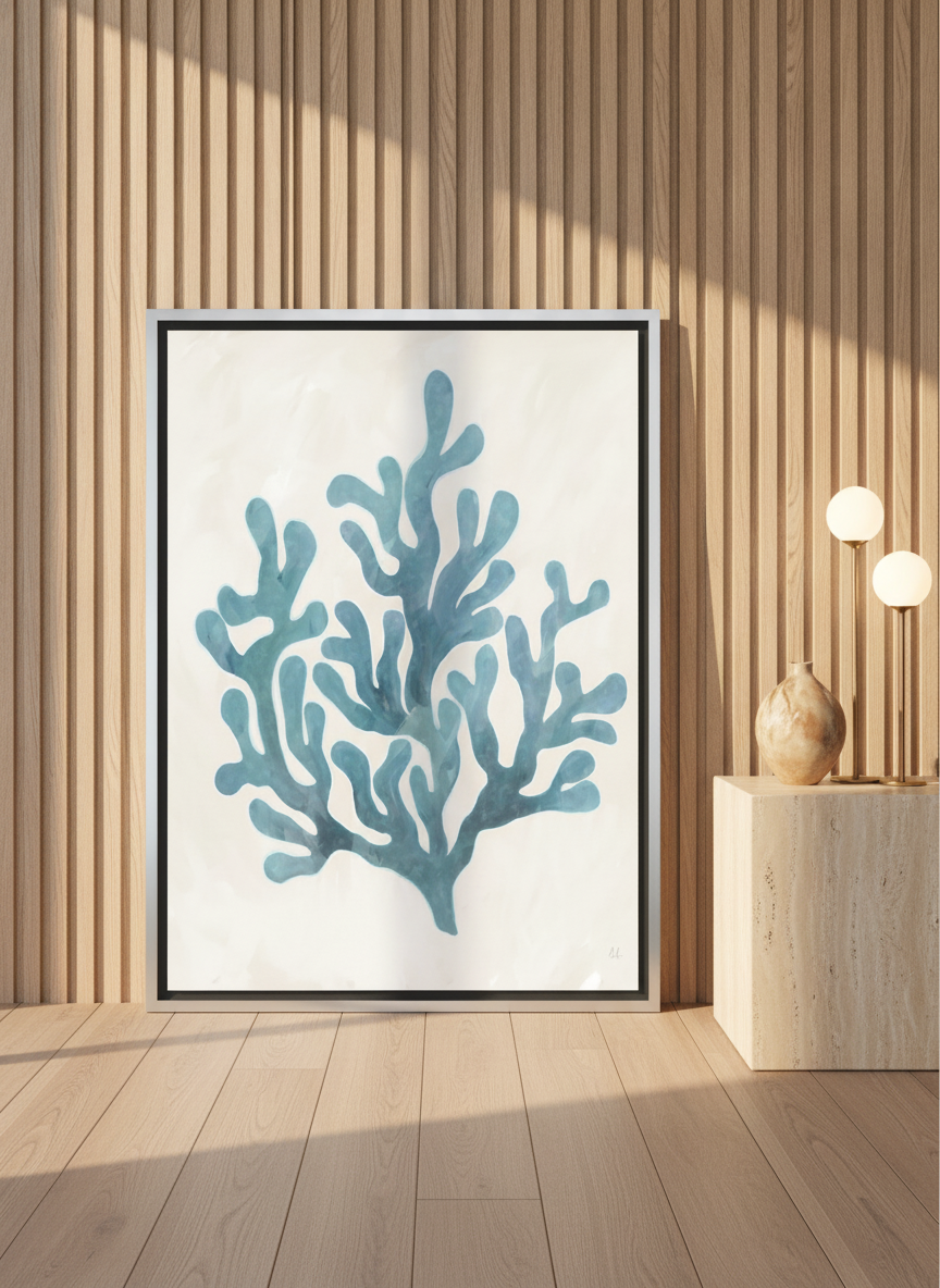 Canvas wall art with a silver leaf surround leaning against the wall in a luxe bathroom