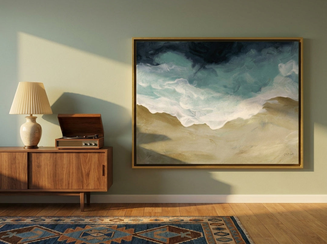 Canvas wall art with a gold leaf surround standing on a sideboard in a mid-century home office