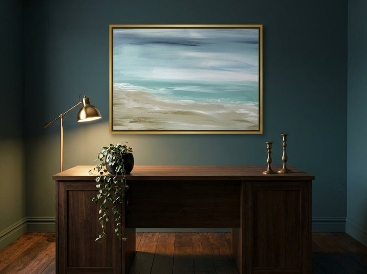 Canvas wall art with a gold leaf surround styled on the wall in a moody home office