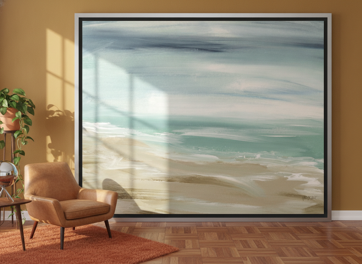 Oversized statement canvas wall art with a silver leaf surround leaning against the wall in a retro 70s dining room