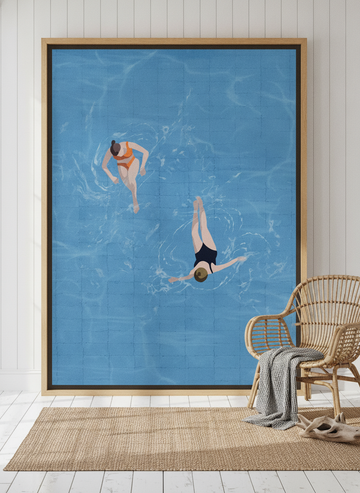 Oversized statement canvas wall art with a natural timber surround leaning against the wall in a coastal bedroom