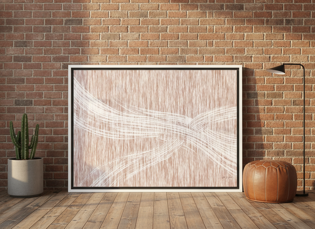 Canvas wall art with a white surround leaning against the wall in an industrial loft bedroom