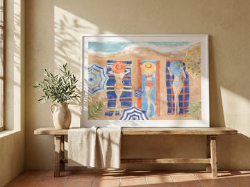 Modern wall art print standing on a bench in a Mediterranean bedroom