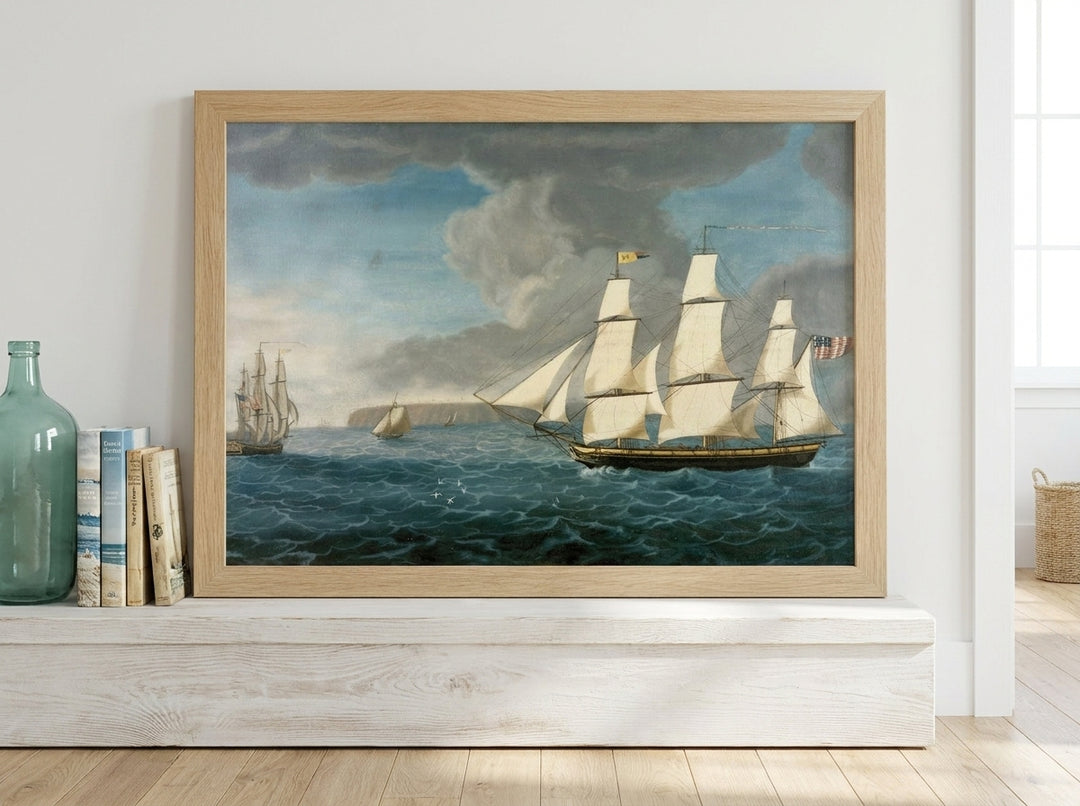 Modern wall art print standing on a console in a coastal living room