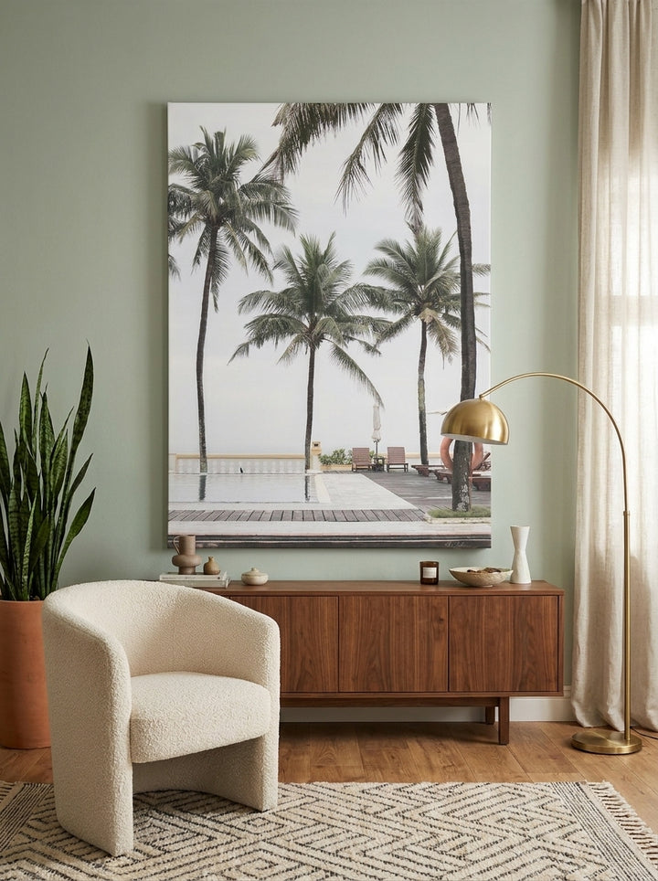 Stretched canvas wall art styled on the wall in a mid-century living room