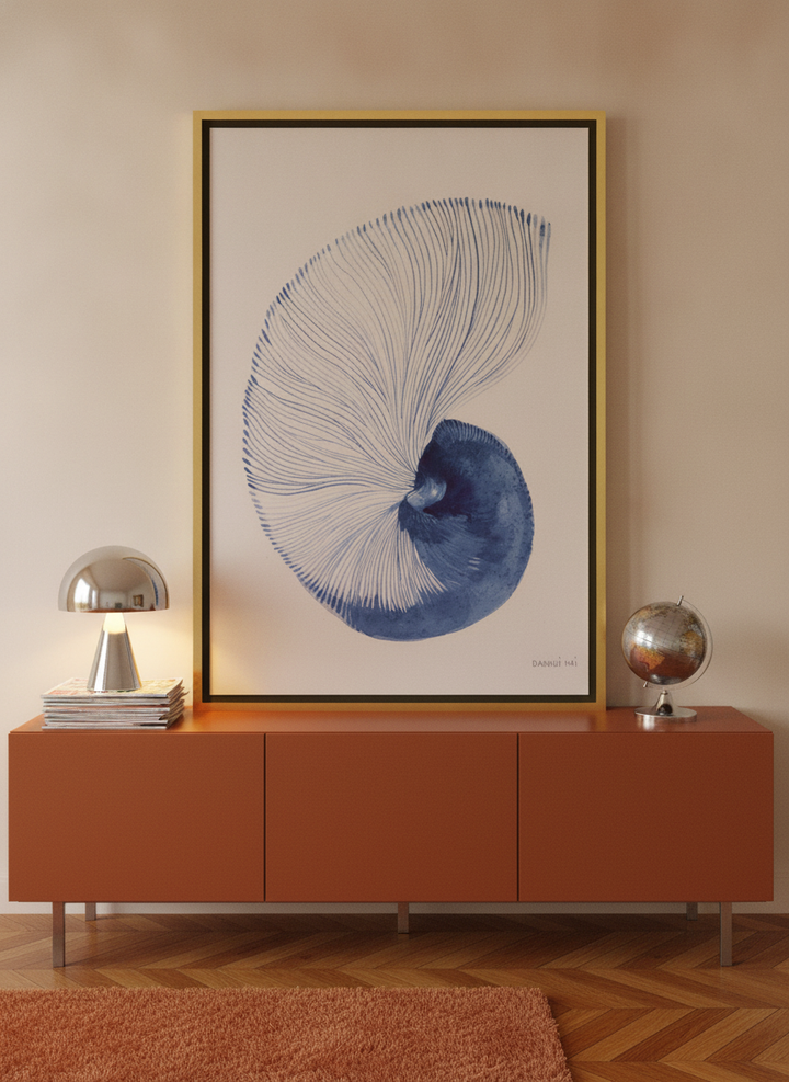Canvas wall art with a gold leaf surround standing on a sideboard in a retro 70s home office