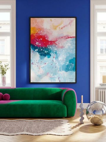 Oversized statement canvas wall art with a white surround styled on the wall in a colourful eclectic living room