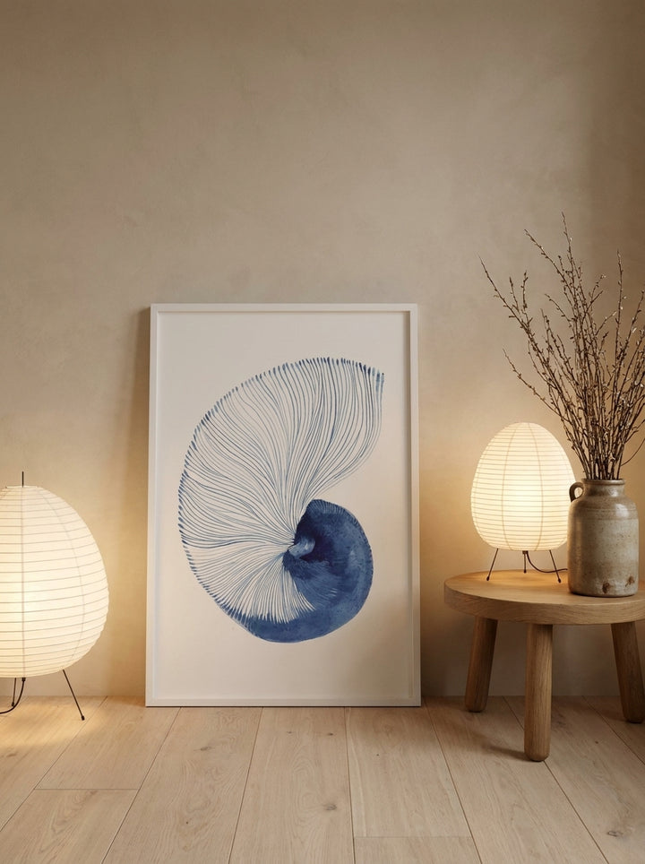 Modern wall art print leaning against the wall in a warm Japandi bedroom