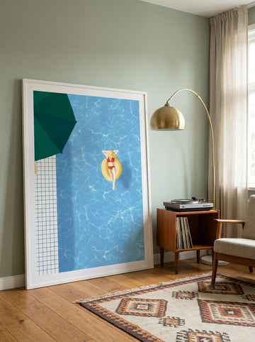 Oversized statement modern wall art print leaning against the wall in a mid-century dining room