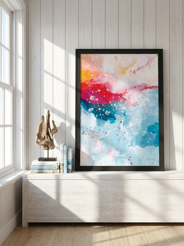 Modern wall art print standing on a console in a coastal dining room
