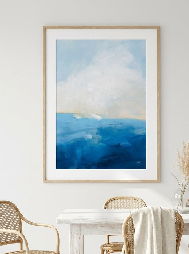 Modern wall art print styled on the wall in a coastal dining room