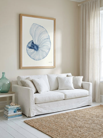 Modern wall art print styled on the wall in a coastal living room