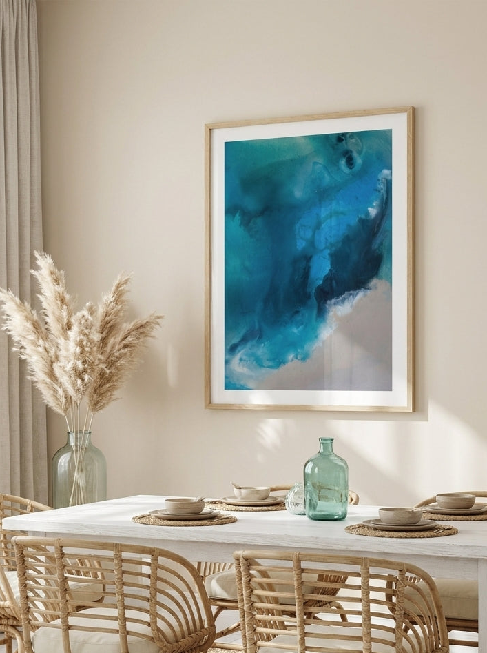 Modern wall art print styled on the wall in a coastal dining room