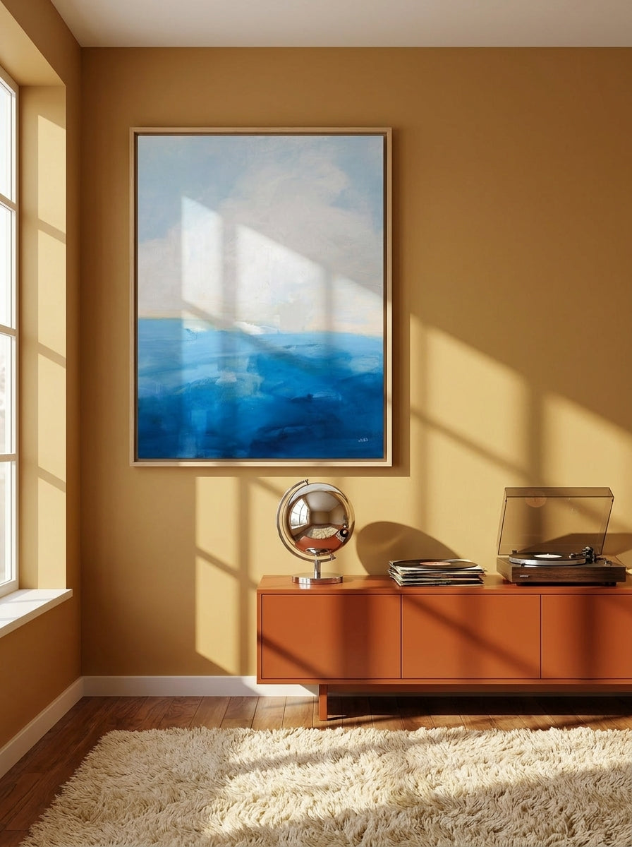 Oversized statement canvas wall art with a natural timber surround styled on the wall in a retro 70s living room