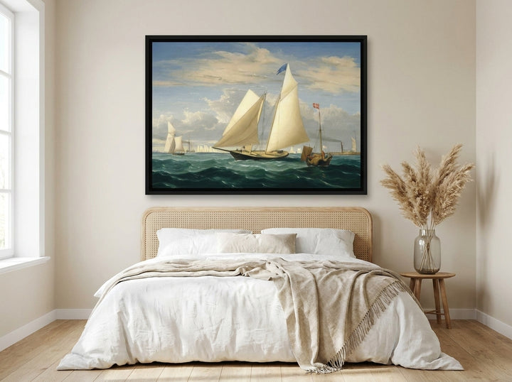 Oversized statement canvas wall art with a black surround styled on the wall in a coastal bedroom