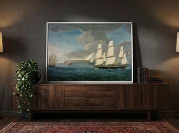 Modern wall art print standing on a sideboard in a moody living room