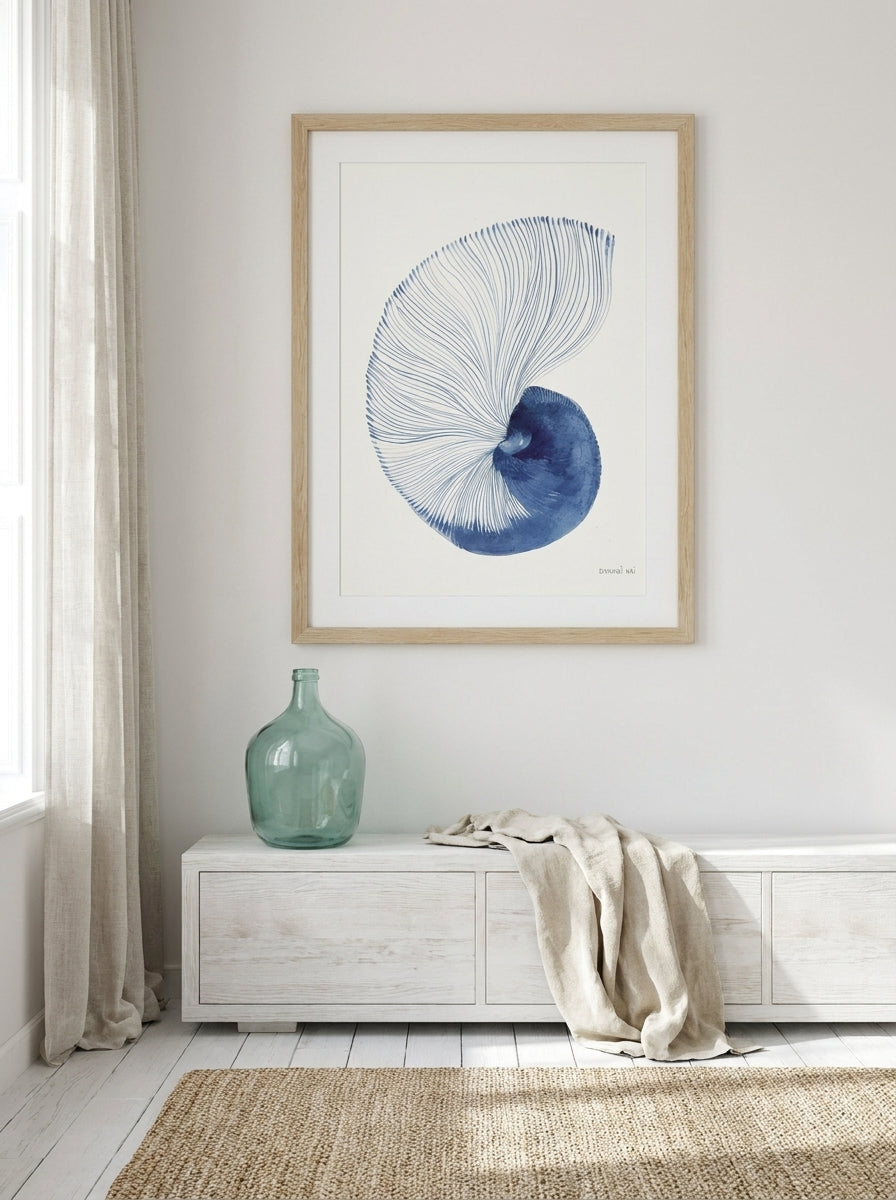 Modern wall art print styled on the wall in a coastal living room