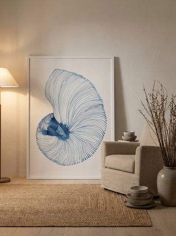 Oversized statement modern wall art print leaning against the wall in a warm Japandi living room