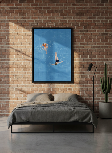 Canvas wall art with a black surround styled on the wall in an industrial loft bedroom