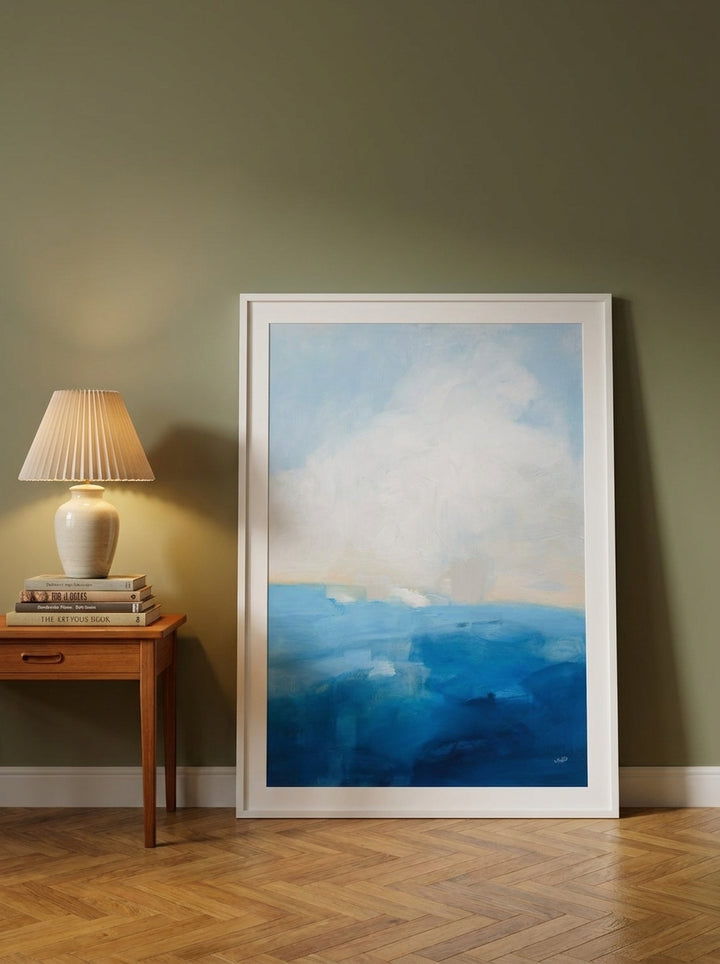 Oversized statement modern wall art print leaning against the wall in a mid-century dining room