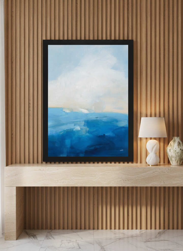 Modern wall art print standing on a console in a luxe bathroom