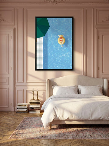 Canvas wall art with a black surround styled on the wall in a Parisian bedroom