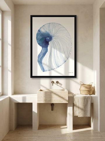Canvas wall art with a black surround styled on the wall in a Mediterranean bathroom