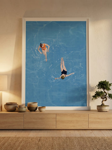 Modern wall art print standing on a sideboard in a warm Japandi bathroom