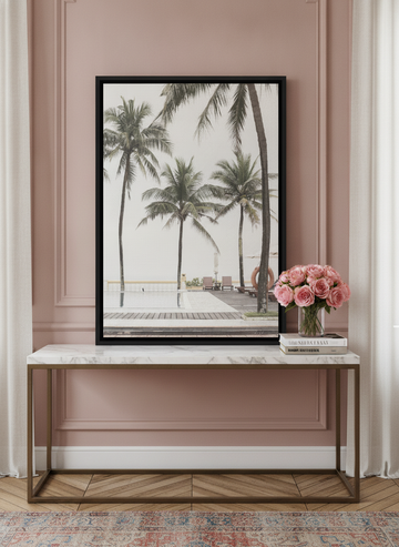 Canvas wall art with a black surround standing on a console in a Parisian home office