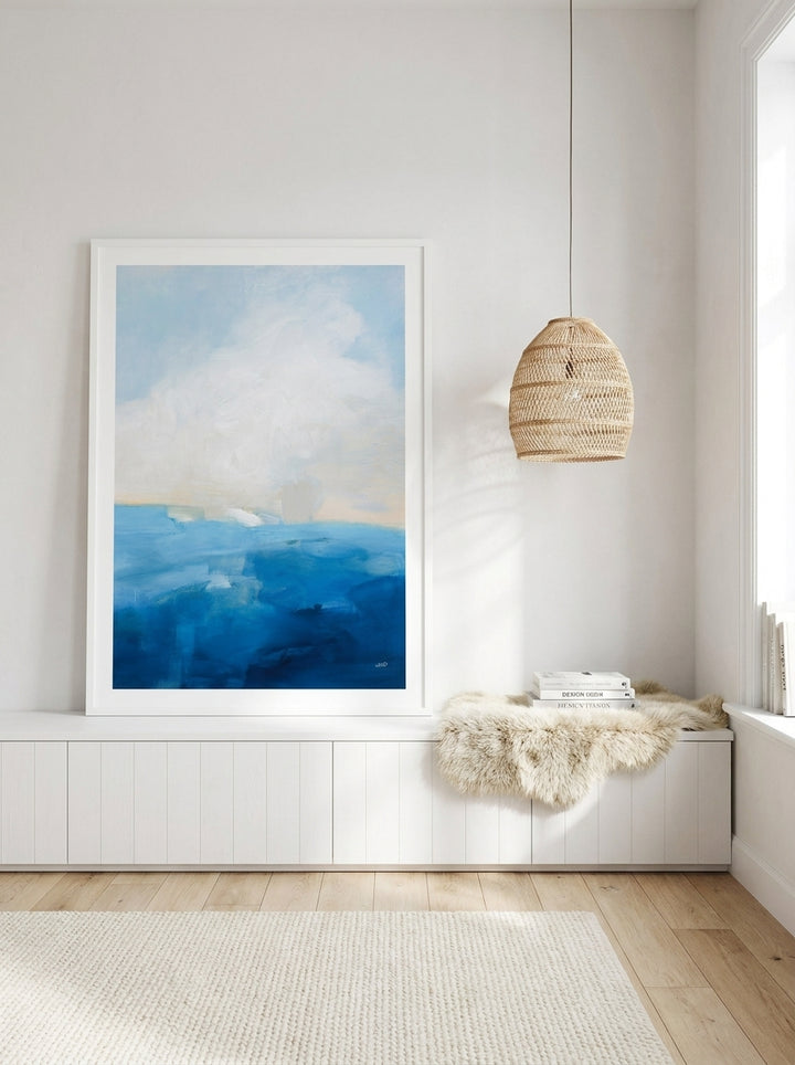 Modern wall art print standing on a sideboard in a bright Scandinavian bedroom