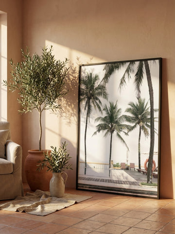 Oversized statement modern wall art print leaning against the wall in a Mediterranean living room