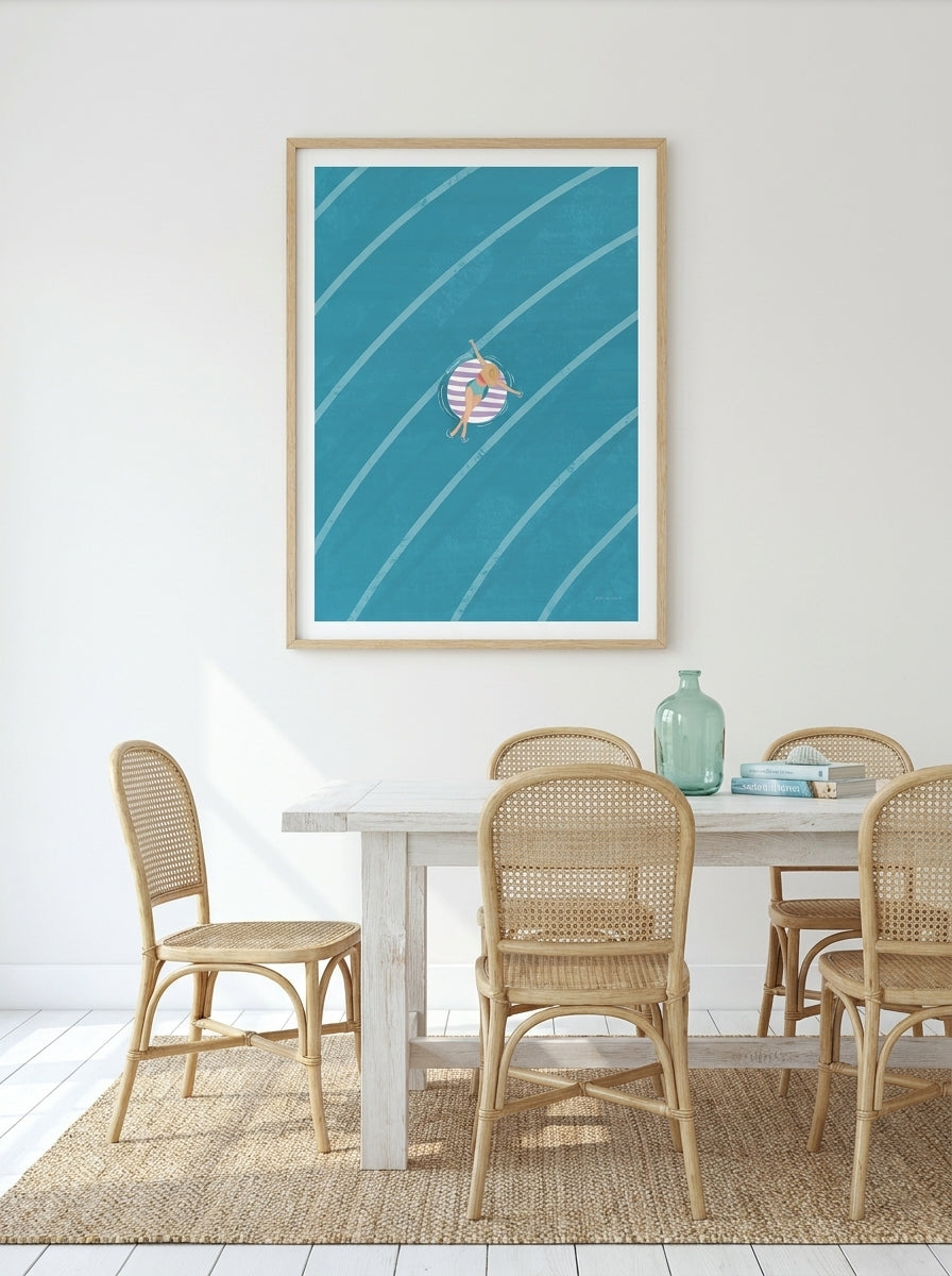 Modern wall art print styled on the wall in a coastal dining room