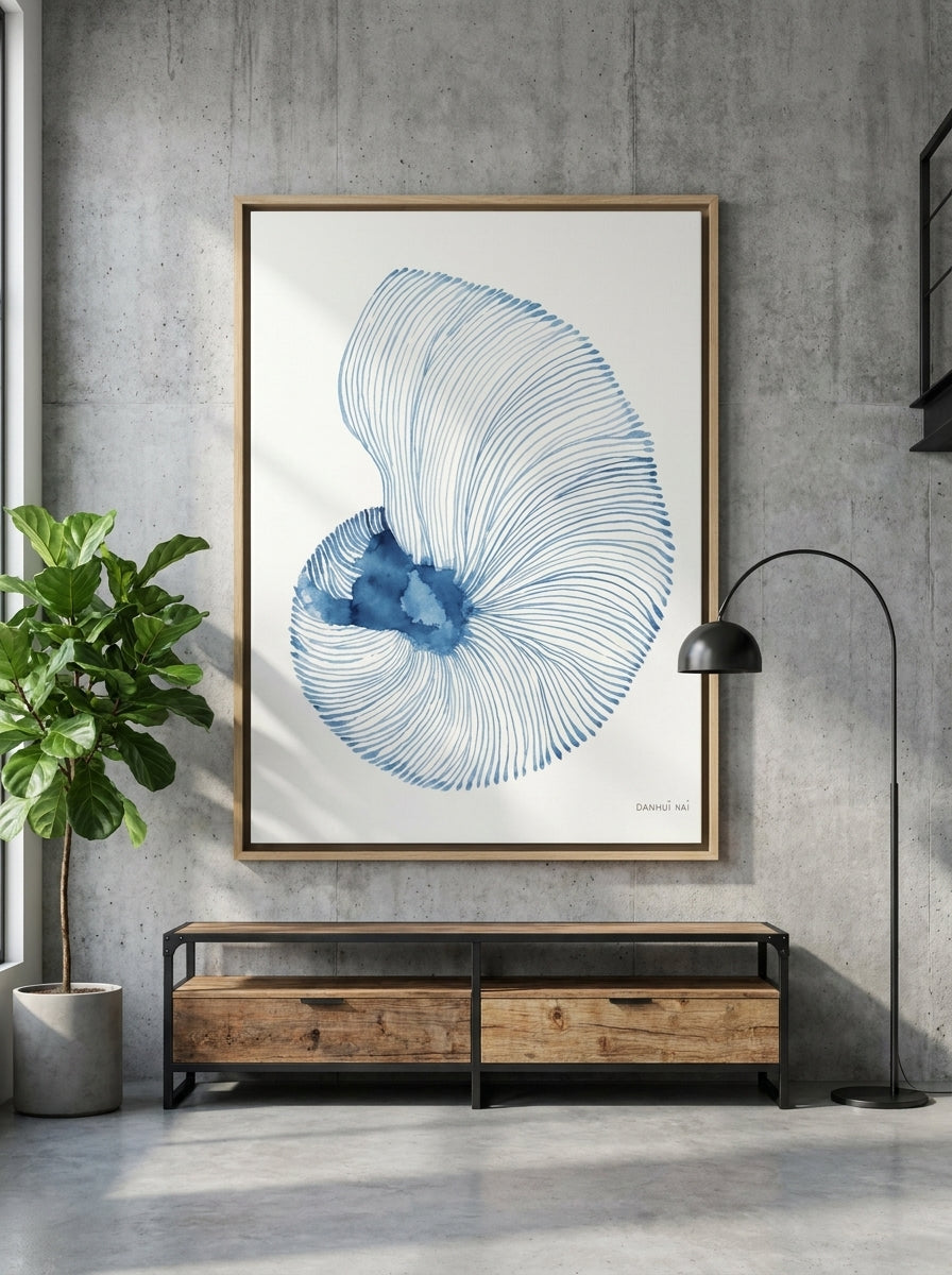 Oversized statement canvas wall art with a natural timber surround styled on the wall in an industrial loft living room