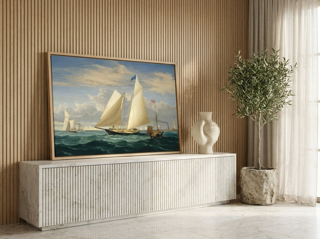 Canvas wall art with a natural timber surround standing on a sideboard in a luxe home office