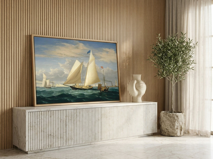 Canvas wall art with a natural timber surround standing on a sideboard in a luxe home office