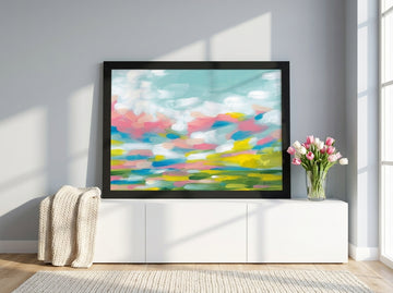 Modern wall art print standing on a sideboard in a bright Scandinavian home office