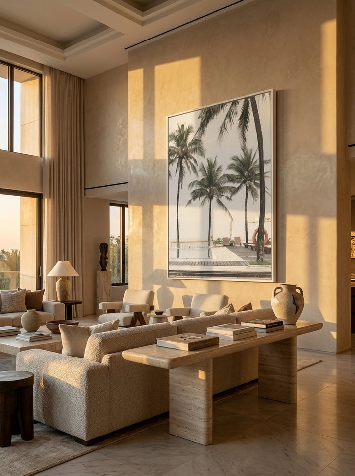 Oversized statement canvas wall art with a white surround styled on the wall in a luxe living room