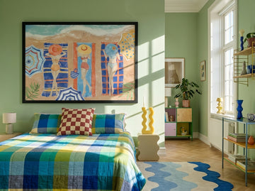 Oversized statement modern wall art print styled on the wall in a colourful eclectic bedroom