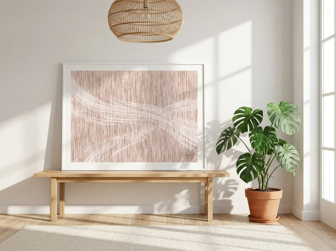 Modern wall art print standing on a bench in a bright Scandinavian home office