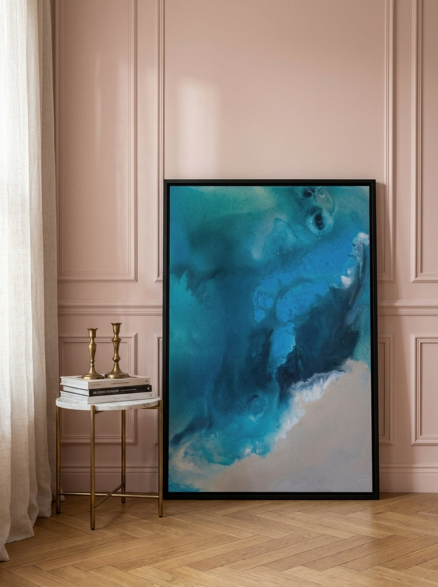 Canvas wall art with a black surround leaning against the wall in a Parisian bedroom